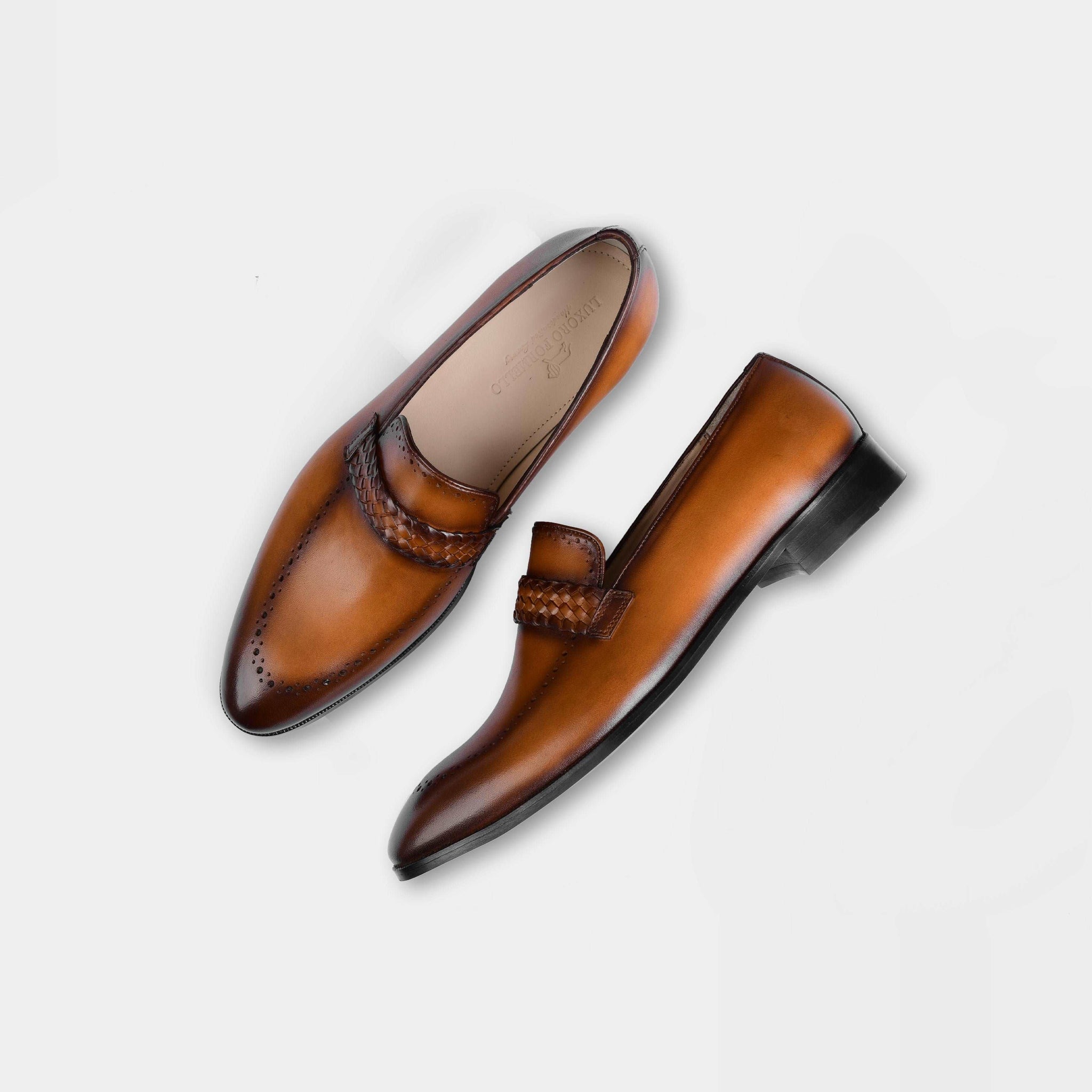 A pair of Alex Tan Leather Loafers in tan brown, featuring a woven leather strap and classic brogue detailing.