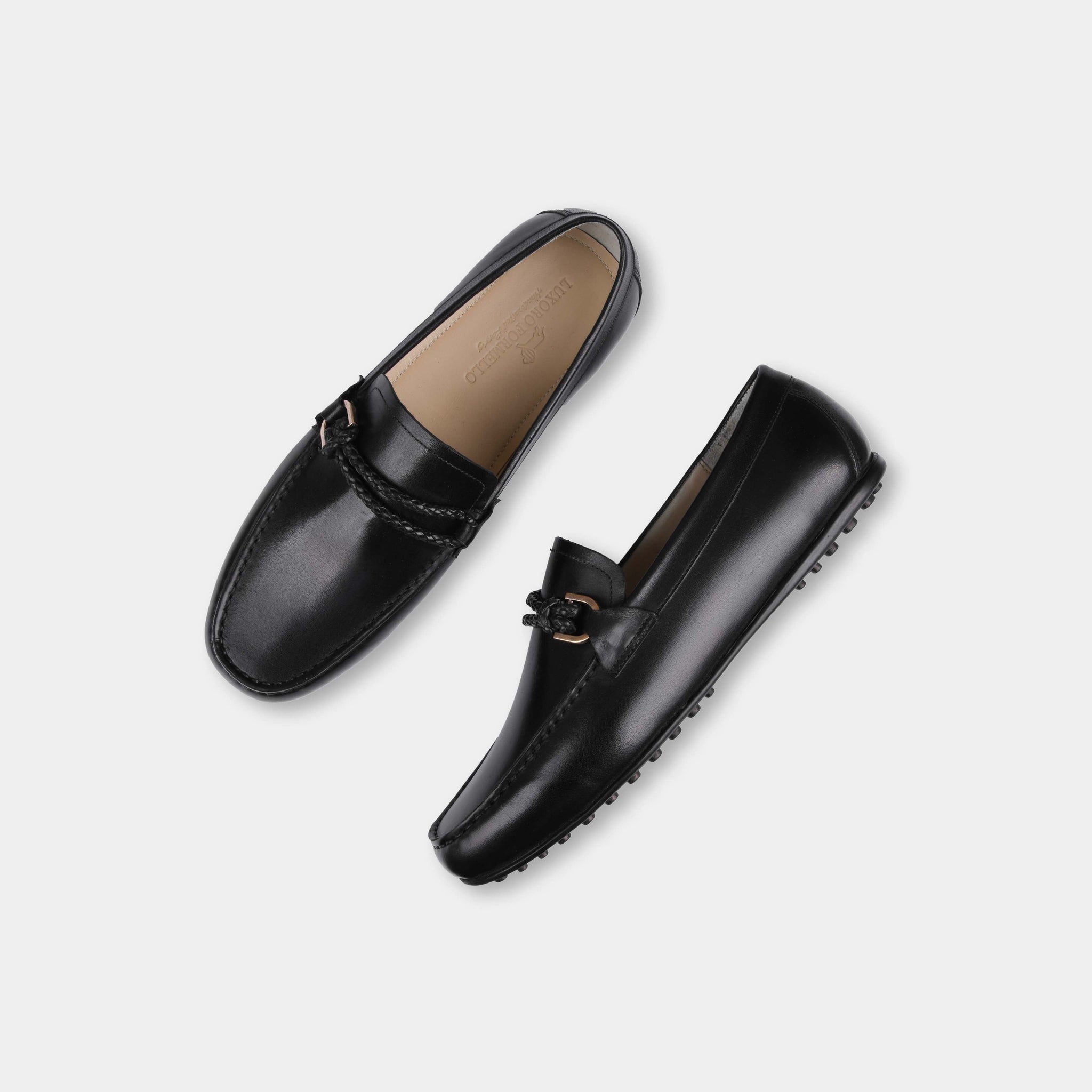 Pair of Pablo Black Leather Driving Loafers with braided strap detail.