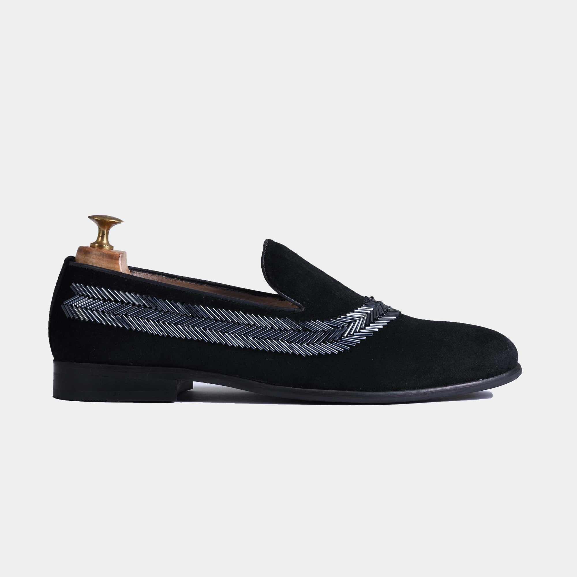 Black velvet men's slip-on loafers with silver embroidered detail and a leather footbed.