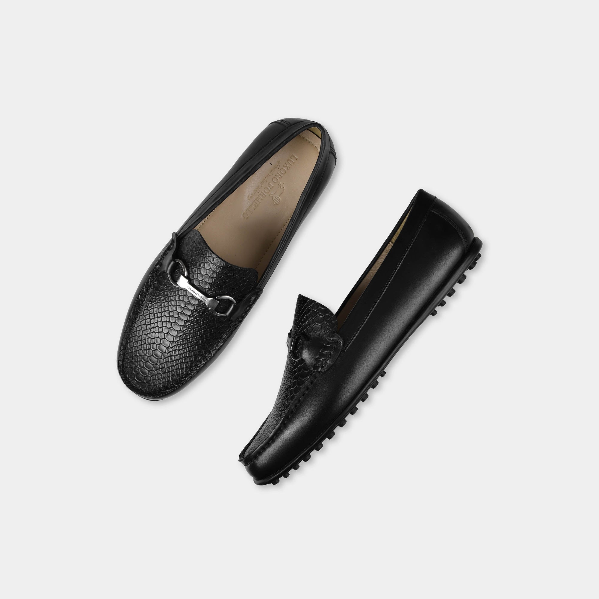 Pair of Matias Black Leather Driving Loafers with silver buckle detail, shown from top and side.