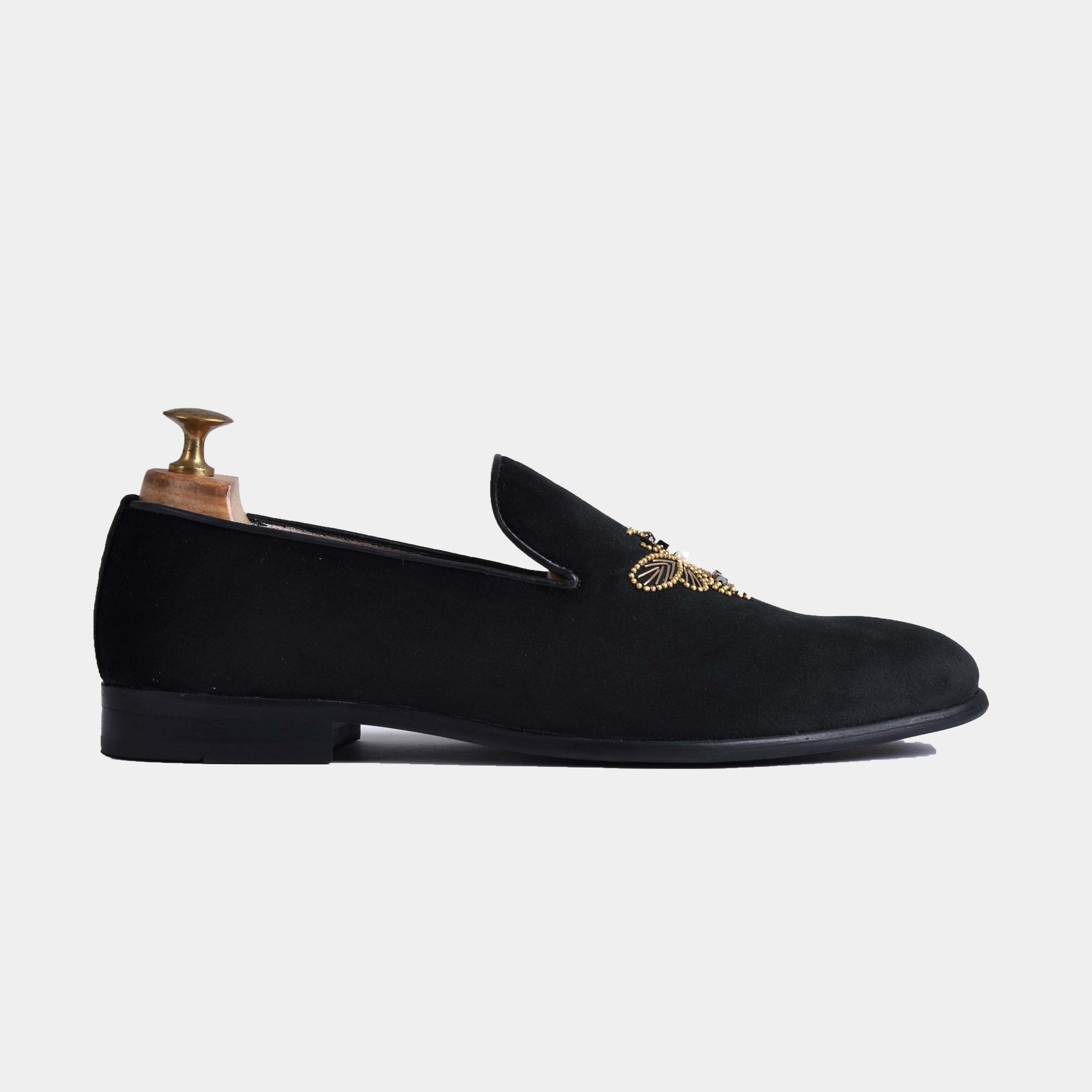 Amado Black Embroidered Leather Slip-Ons, featuring intricate gold embroidery on black velvet.