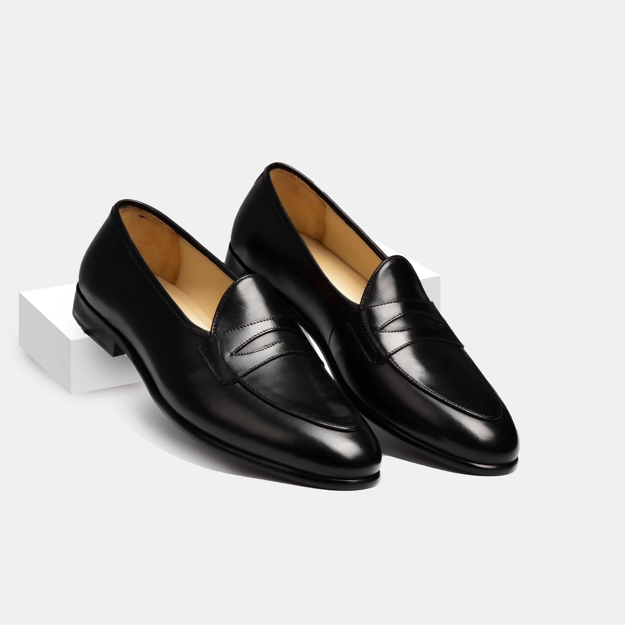 Pair of Arno Loafers in black patina leather with a classic grand penny detail across the vamp.