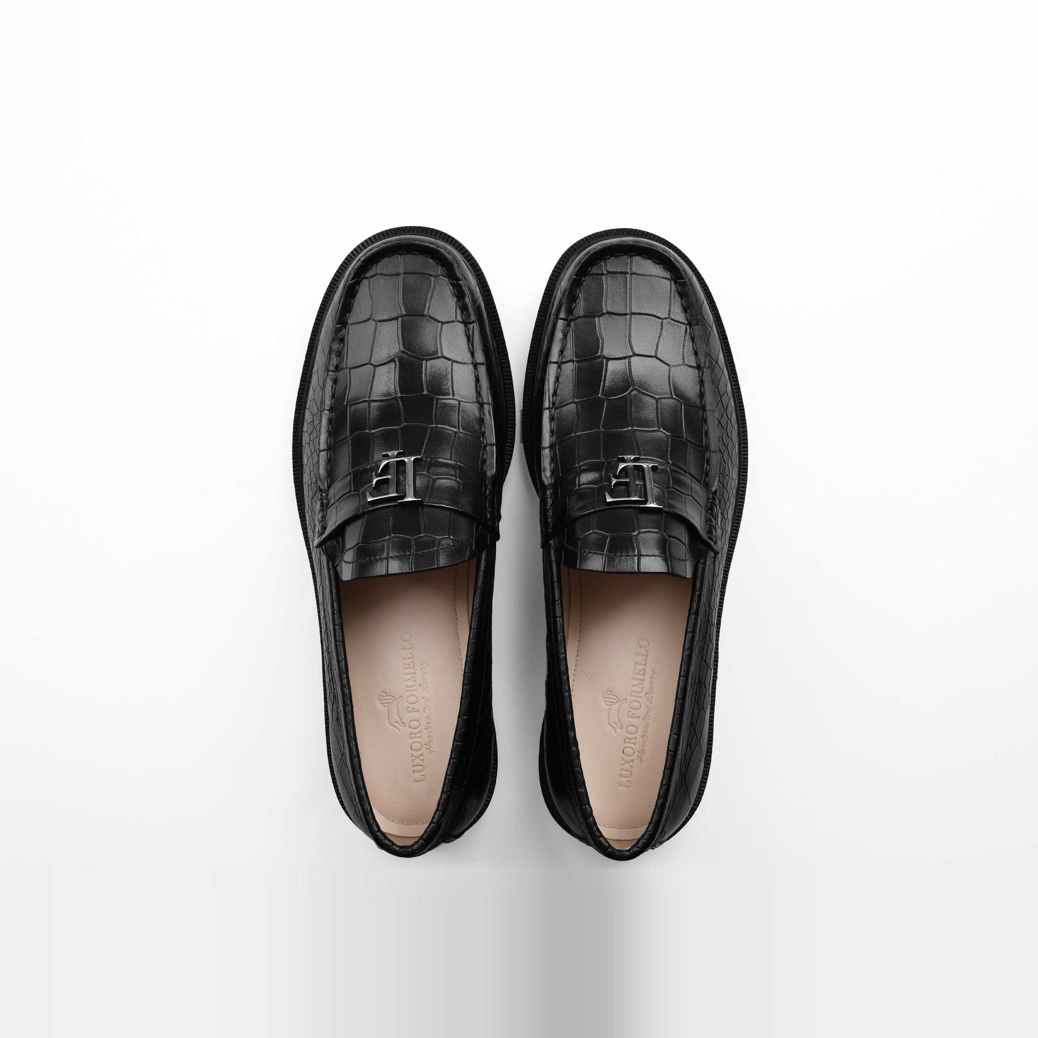 Pair of black crocodile leather loafers, Solesculpt Lite, on a white background.