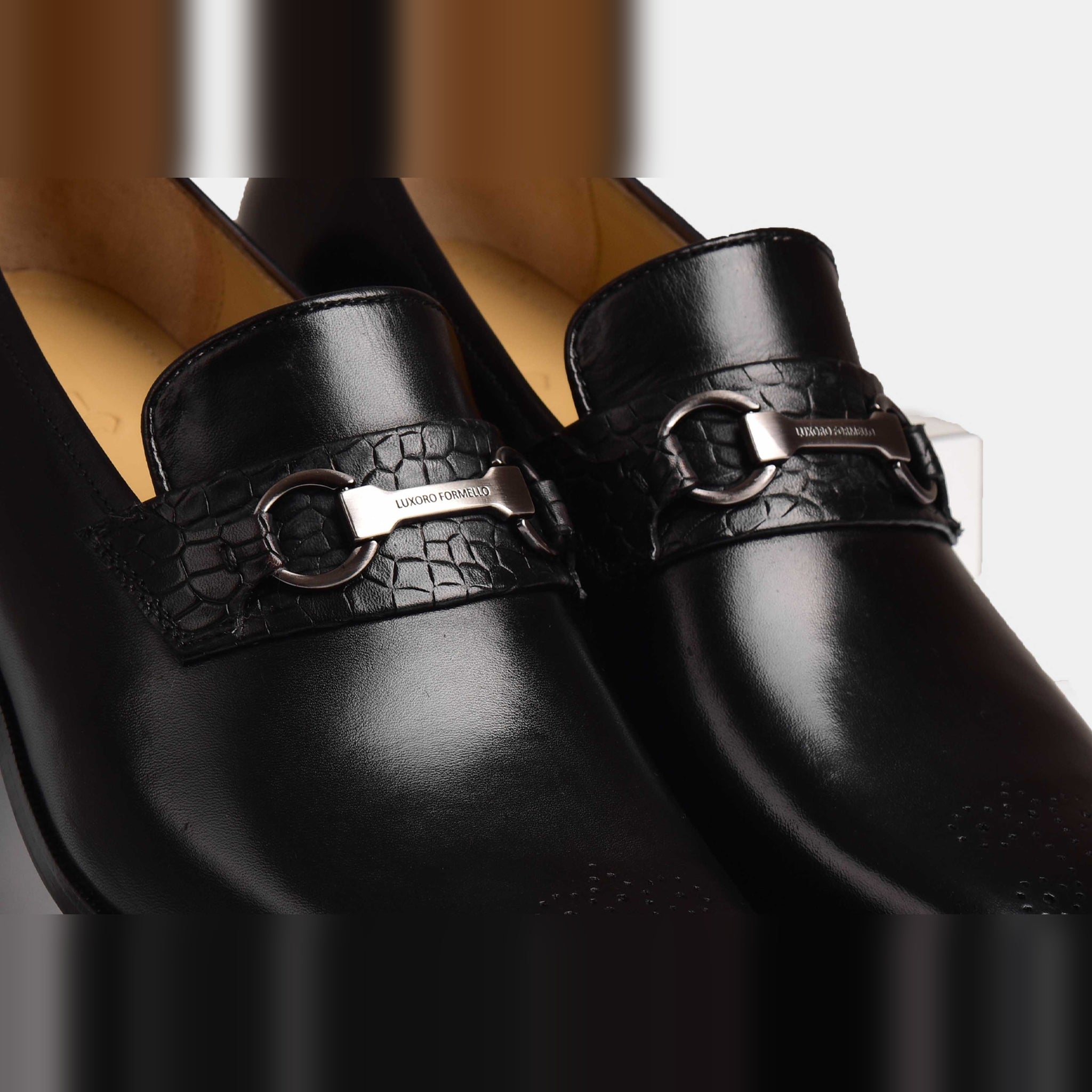 Pair of Diaz Black Loafers, featuring a sleek black leather upper and a stylish metal buckle detail.