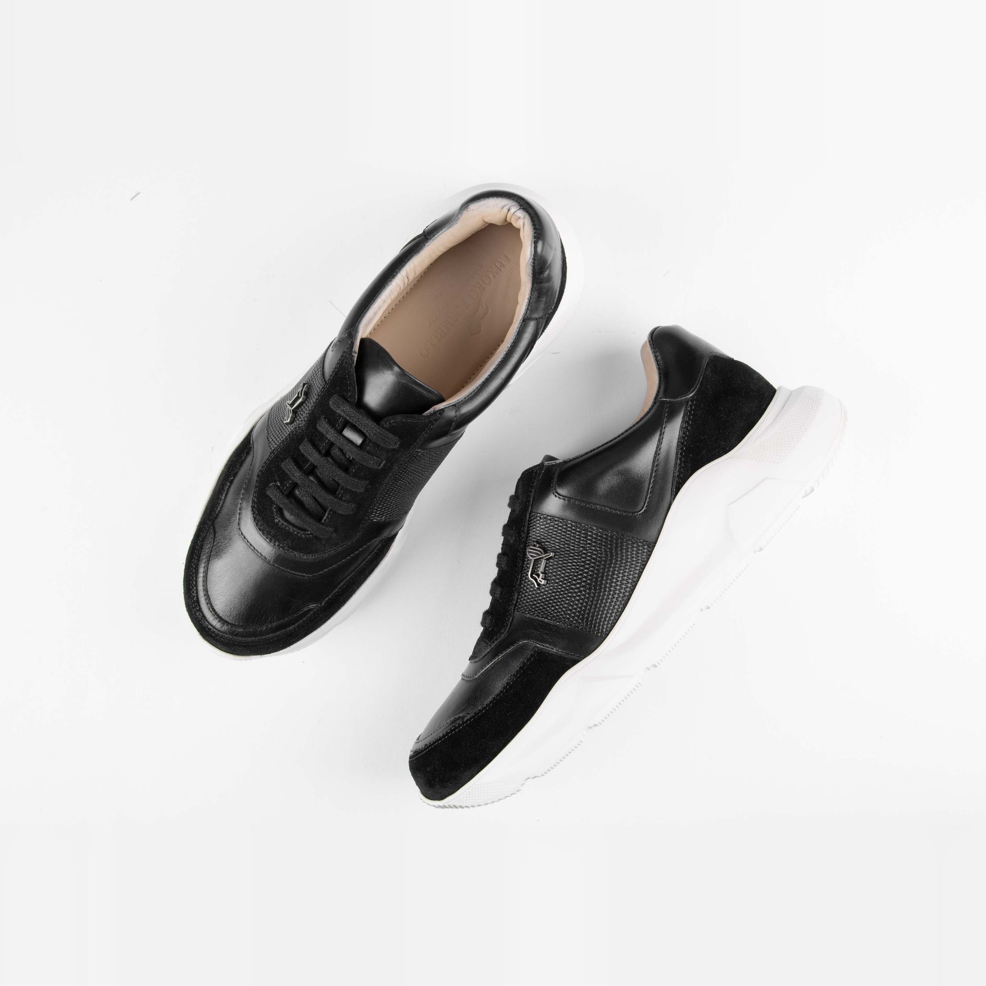 Aureo Black leather sneakers with white soles, showcasing their sleek and modern design on a clean white background.