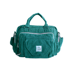 Green Himalayan hemp laptop side bag with multiple pockets, silver zippers, and adjustable strap for comfortable carrying.